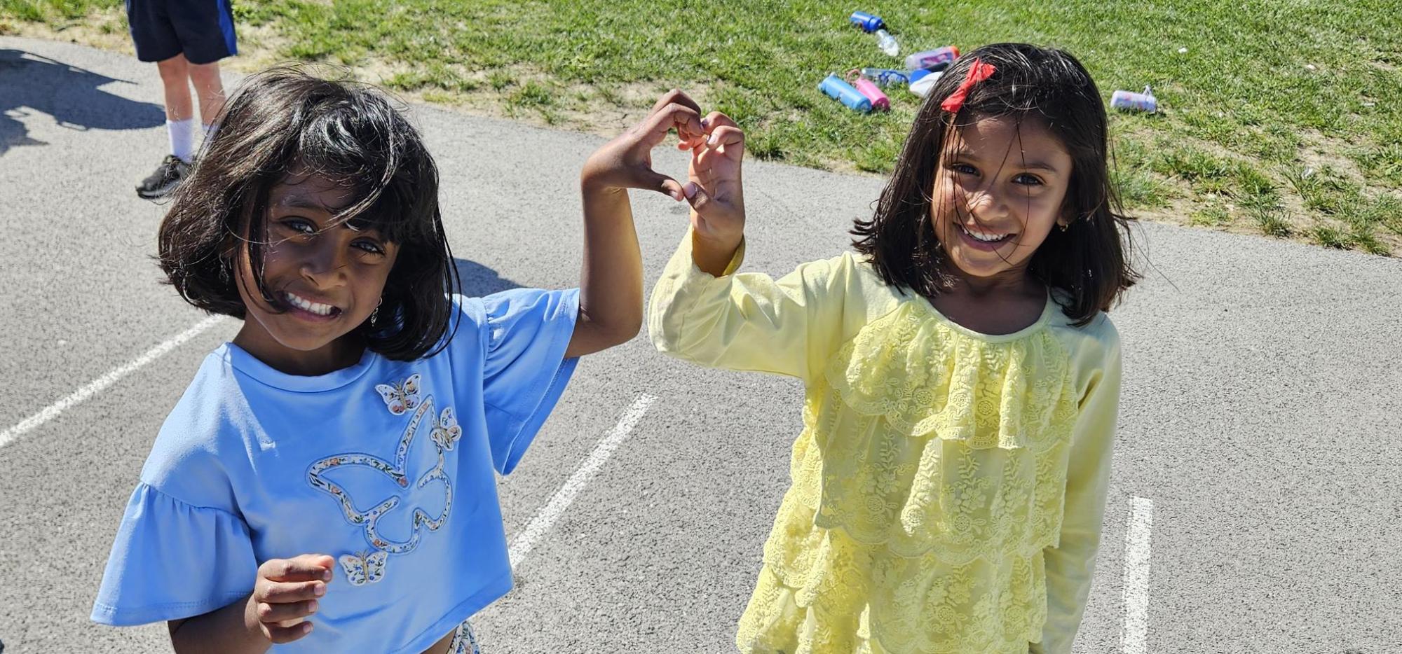 friends making heart with hands