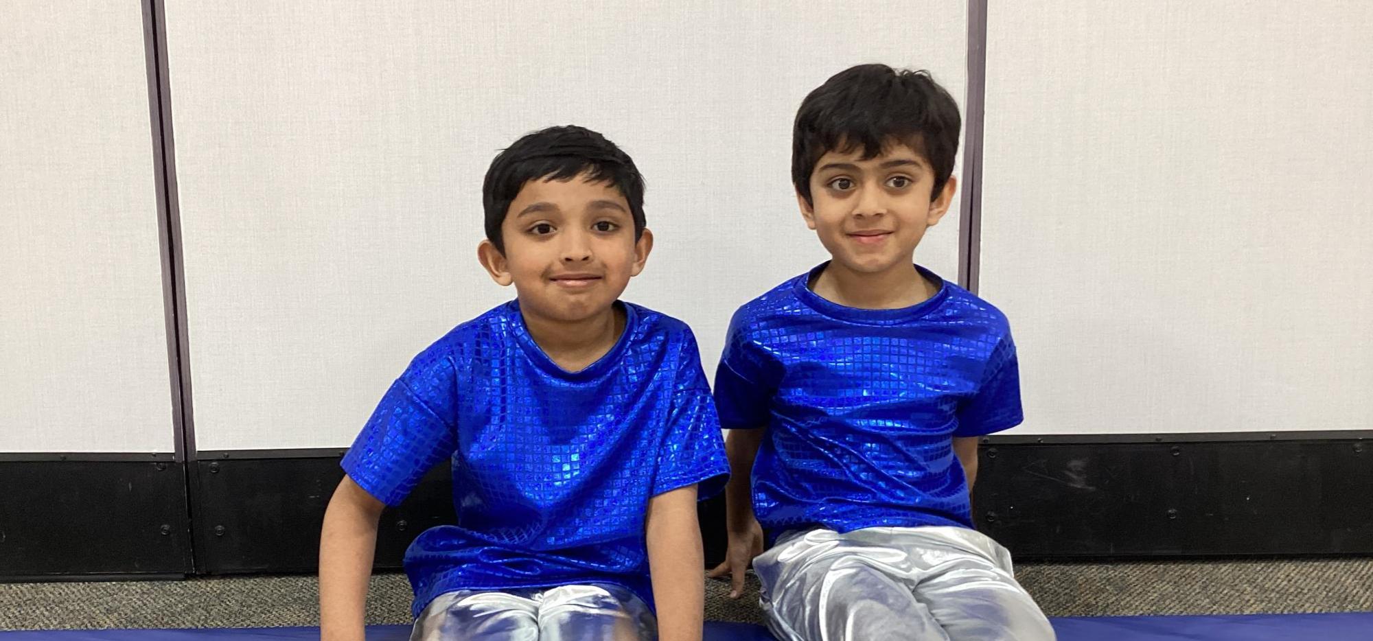 two boys in dance costume