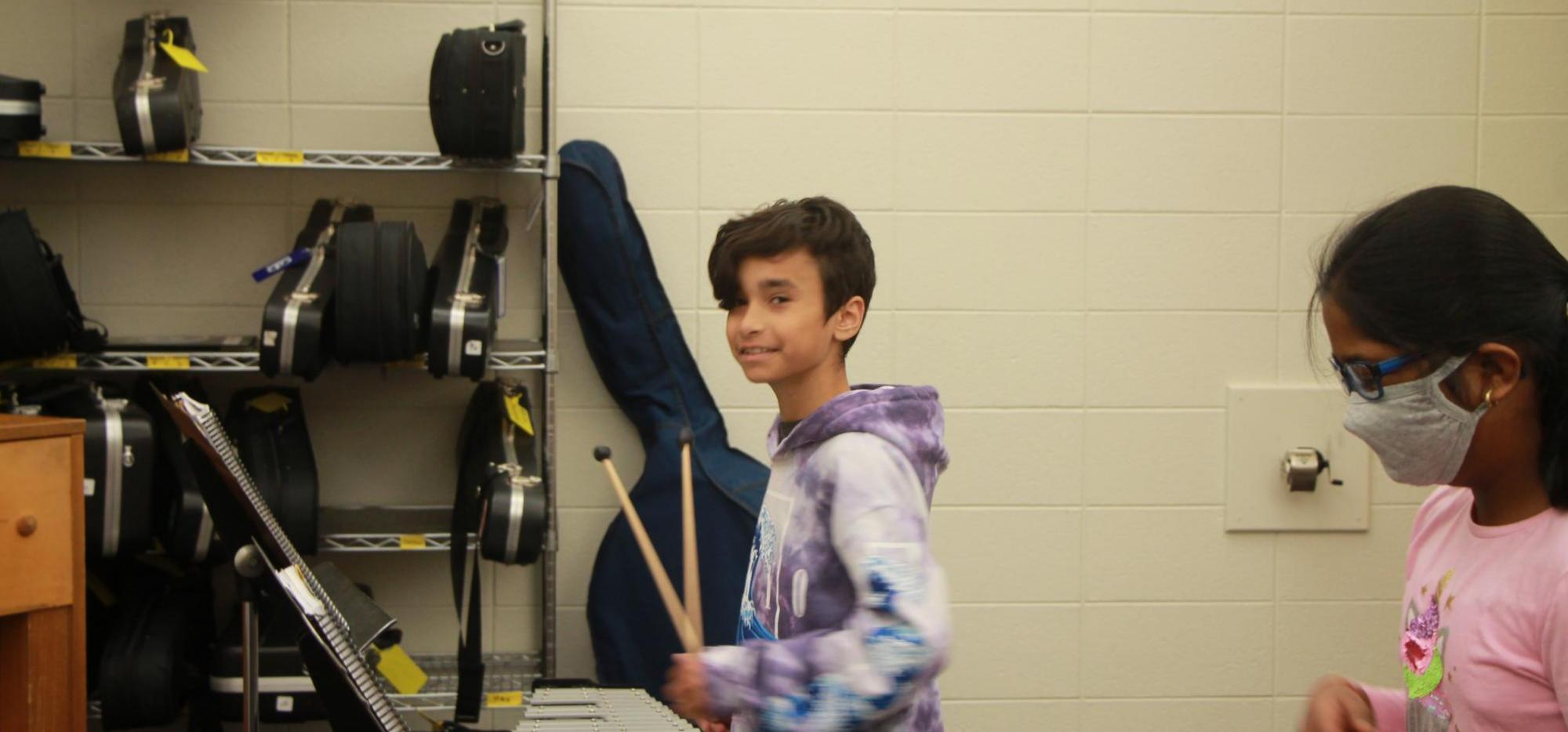 student in band class